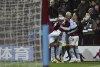 Aston Villa's Ezri Konsa, right, celebrates with teammates after scoring a goal during the English Premier League soccer match between Aston Villa and Leicester City at Villa Park in Birmingham, England, Sunday, Dec. 5, 2021. (AP Photo/Rui Vieira)