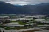 A helicopter flies over flooded farmland in Abbotsford, B.C., on Wednesday, December 1, 2021. THE CANADIAN PRESS/Darryl Dyck