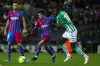 Barcelona's Riqui Puig, center, vies for the ball with Betis' William Carvalho during the Spanish La Liga soccer match between Barcelona and Real Betis at the Camp Nou stadium, in Barcelona, Spain, Saturday, Dec. 4, 2021. (AP Photo/Joan Monfort)