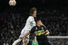 Real Madrid's Luka Modric, top, goes for a header with Inter Milan's Alexis Sanchez during the Champions League group D soccer match between Real Madrid and Inter Milan at the Santiago Bernabeu stadium, in Madrid, Spain, Tuesday, Dec. 7, 2021. Real Madrid won 2-0. (AP Photo/Bernat Armangue)
