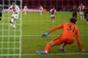 Ajax's Sebastien Haller, left, scores his side's first goal past Sporting's goalkeeper Joao Virginia during a Champions League group C soccer match between Ajax and Sporting CP, at the at the Johan Cruyff ArenA in Amsterdam, Netherlands, Tuesday, Dec. 7, 2021. (AP Photo/Andrew Medichini)