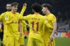 Liverpool's Mohamed Salah, center, celebrates with teammates after scoring his side's first goal during the Champions League, Group B soccer match between AC Milan and Liverpool at the San Siro stadium in Milan, Italy, Tuesday, Dec. 7, 2021. (AP Photo/Luca Bruno)