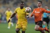 Sheriff's Momo Yansane, left, challenges for the ball with Shakhtar's Valeriy Bondar during the Champions League group D soccer match between Shakhtar Donetsk and FC Sheriff Tiraspol at the Olympiyskiy stadium in Kyiv, Ukraine, Tuesday, Dec. 7, 2021. (AP Photo/Efrem Lukatsky)