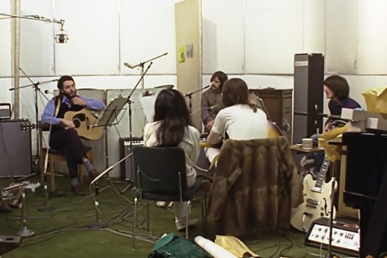 This image released by Disney+ shows, background from left, Paul McCartney, Ringo Starr and George Harrison, and foreground from left, Yoko Ono and John Lennon in a scene from the nearly 8-hour Peter Jackson-produced documentary 