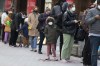 People wait in line outside a COVID-19 walk-in testing site, Sunday, Dec. 5, 2021, in Cambridge, Mass. (AP Photo/Michael Dwyer)