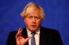 Britain's Prime Minister Boris Johnson speaks at a press conference in London's Downing Street, Wednesday Dec. 8, 2021, after ministers met to consider imposing new restrictions in response to rising cases and the spread of the omicron variant. (Adrian Dennis/Pool via AP)