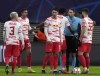 Referee Sandro Scharer, second right, discusses with Leipzig players during the Group A Champion's League soccer match between RB Leipzig and Manchester City at the Red Bull Arena in Leipzig, Germany, Tuesday, Dec. 7, 2021. (AP Photo/Michael Sohn)