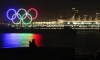 A photographer takes photographs of a 14 metre tall set of Olympic rings illuminated on a barge in the harbour just off Stanley Park in Vancouver, B.C., on Wednesday November 4, 2009. THE CANADIAN PRESS/Darryl Dyck