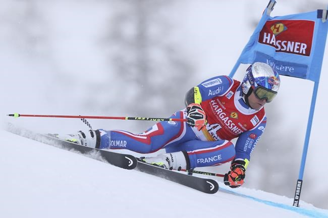 France's Alexis Pinturault speeds down the course during the first run of an alpine ski, men's World Cup giant slalom, in Val D'Isere, France, Saturday, Dec. 11, 2021. (AP Photo/Alessandro Trovati)