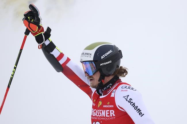 Austria's Manuel Feller completes an alpine ski, men's World Cup giant slalom, in Val D'Isere, France, Saturday, Dec. 11, 2021. (AP Photo/Alessandro Trovati)