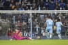 Manchester City's Raheem Sterling, right, scores his side's first goal on a penalty kick during the English Premier League soccer match between Manchester City and Wolverhampton Wanderers, at the Etihad stadium in Manchester, England, Saturday, Dec.11, 2021. (AP Photo/Dave Thompson)