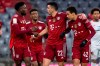 From left. Alphonso Davies, Kingsley Coman, Marc Roca and scorer Jamal Musiala of Munich celebrate their sides second goal during the German Bundesliga soccer match between FC Bayern Munich and FSV Mainz 05 in Munich, Germany, Saturday, Dec. 11, 2021. Munich defeated Mainz by 2:1. (Sven Hoppe/dpa via AP)