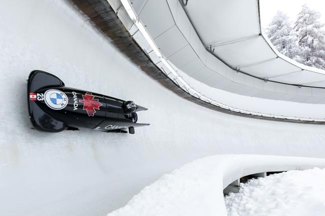 Cynthia Appiah and Dawn Richardson Wilson from Canada speed down the track during the women's two-women bobsleigh World Cup race in Igls, near Innsbruck, Austria, Sunday, Nov. 28, 2021. Canada won bronze in the monobob and four-man races Saturday at the Winterberg World Cup bobsled competition. THE CANADIAN PRESS/AP-Lisa Leutner