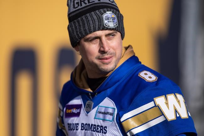 Quarterback Zach Collaros (8) speaks to media following Winnipeg Blue Bombers walkthrough at Tim Hortons Field during the CFL's Grey Cup week in Hamilton, Ont., Saturday, Dec. 11, 2021. Collaros' football brain will be hard at work in advance of Sunday's Grey Cup. But he will also be quietly giving thanks before taking the field against the Hamilton Tiger-Cats. THE CANADIAN PRESS/Nick Iwanyshyn