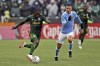 Portland Timbers midfielder Yimmi Chara (23) dribbles ahead of New York City FC midfielder Alfredo Morales (7) during the first half of the MLS Cup soccer match Saturday, Dec. 11, 2021, in Portland, Ore. (AP Photo/Amanda Loman)