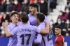 Barcelona's Nico Gonzalez, right, celebrates with teammates after scoring the opening goal of the game during the La Liga soccer match between Osasuna and FC Barcelona at the El Sadar stadium in Pamplona, Spain, Sunday, Dec. 12, 2021. (AP Photo/Alvaro Barrientos)