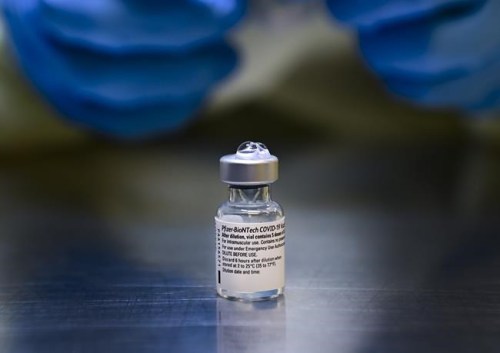 A health-care worker prepares a dose of the Pfizer-BioNTech COVID-19 vaccine at a UHN COVID-19 vaccine clinic in Toronto on Thursday, January 7, 2021. Ontarians aged 50 and older can book COVID-19 booster doses starting today if six months have passed since their second shots. THE CANADIAN PRESS/Nathan Denette