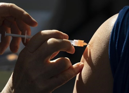 A dose of the Pfizer-BioNTech vaccine is given to a recipient at a vaccination site in Vancouver Thursday, March 11, 2021.  THE CANADIAN PRESS/Jonathan Hayward