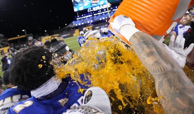 The Winnipeg Blue Bombers celebrate their victory against the Hamilton Tiger-Cats in the 108th CFL Grey Cup in Hamilton, Ont., on Sunday, December 12, 2021. THE CANADIAN PRESS/Ryan Remiorz