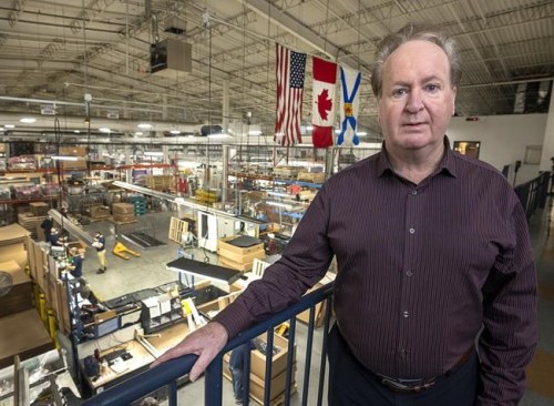 Pat Ryan, president of Neocon International, stands above the factory floor in Dartmouth, N.S. on Wednesday, Dec. 8, 2021. Ryan is taking advantage of the rise of the production of electric vehicles is building a 5,500-square metre addition to his plastic parts factory, and hiring 138 new workers, in part to keep up with electric vehicle orders that include the plastic flooring of the new Rivian delivery van. THE CANADIAN PRESS/Andrew Vaughan