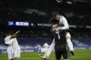 Real Madrid's team players celebrate as they won the Spanish La Liga soccer match between Real Madrid and Atletico Madrid at Santiago Bernabeu stadium in Madrid, Spain, Sunday, Dec. 12, 2021. (AP Photo/Bernat Armangue)
