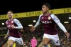 Aston Villa's Jacob Ramsey, right, celebrates scoring during the English Premier League soccer match between Norwich City and Aston Villa at Carrow Road, Norwich, England, Tuesday Dec. 14, 2021. (Joe Giddens/PA via AP)