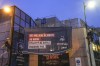 Amnesty International activists unfurl a banner on the building of the French soccer federation headquarters that reads, 