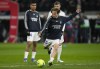 Real Madrid's Luka Modric, center, warms up before the Spanish La Liga soccer match between Real Madrid and Atletico Madrid at Santiago Bernabeu stadium in Madrid, Spain, Sunday, Dec. 12, 2021. (AP Photo/Bernat Armangue)