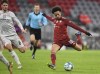 Bayern's Leroy Sane kicks the ball during a German Bundesliga soccer match between Bayern Munich and FSV Mainz 05 at the Allianz Arena in Munich, Germany, Saturday, Dec. 11, 2021. (AP Photo/Andreas Schaad)