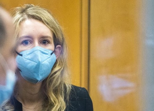 Elizabeth Holmes walks into federal court in San Jose, Calif., Thursday, Dec. 16, 2021. The lawyers for the opposing sides in the trial of former Theranos CEO are expected to wrap up their closing arguments Friday, paving the way for a jury to begin their deliberations over criminal charges accusing her of turning her blood-testing startup into a massive scam.  (AP Photo/Nic Coury)