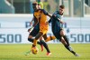 Atalanta's Berat Djimsiti, right, vies for the ball with Roma's Tammy Abraham, during the Serie A soccer match between Calcio Atalanta and AS Roma at Gewis Stadium, in Bergamo, Italy, Saturday Dec. 18, 2021. (Spada/LaPresse via AP)