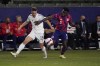 United States defender George Bello, right, defends Bosnia and Herzegovina midfielder Andrej Dokanovic during the first half of an international friendly soccer match, Saturday, Dec. 18, 2021, in Carson, Calif. (AP Photo/Marcio Jose Sanchez)