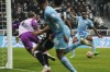 Manchester City's Raheem Sterling scores his side's fourth goal, during the English Premier League soccer match between Newcastle and Manchester City at St. James' Park, Newcastle, England, Sunday, Dec. 19, 2021. (Owen Humphreys/PA via AP)