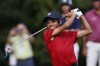 Charlie Woods, son of Tiger Woods, watches his shot on the first tee during the second round of the PNC Championship golf tournament Sunday, Dec. 19, 2021, in Orlando, Fla. (AP Photo/Scott Audette)
