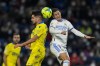 Real Madrid's Eden Hazard, right, and Cadiz's Ruben Sobrino head the ball during the La Liga soccer match between Real Madrid and Cadiz at Santiago Bernabeu stadium in Madrid, Spain, Sunday, Dec. 19, 2021. (AP Photo/Bernat Armangue)