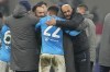 Napoli's head coach Luciano Spalletti, center right, celebrates with team players as they won the Serie A soccer match between AC Milan and Napoli at the San Siro stadium in Milan, Italy, Sunday, Dec. 19, 2021. (AP Photo/Antonio Calanni)