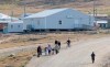 Residents walk through the streets of Pangnirtung, Nunavut on Thursday, Aug. 20, 2009. Travel is restricted to the hamlet in Nunavut after two cases of COVID-19 were identified late Monday. THE CANADIAN PRESS/Adrian Wyld
