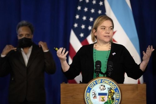 Chicago Department of Public Health Commissioner Dr. Allison Arwady speaks during a press conference at City Hall, Tuesday, Dec. 21, 2021, in Chicago. Chicago will require proof of coronavirus vaccination at restaurants, bars, gyms and other indoor venues, as the rapidly spreading omicron variant drives a spike in COVID-19 infections, Mayor Lori Lightfoot said Tuesday. (Erin Hooley/Chicago Tribune via AP)