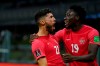 Canada's Jonathan Osorio, 21, celebrates scoring his side's first goal against Mexico with teammate Alphonso Davies during a qualifying soccer match for the FIFA World Cup Qatar 2022, at Azteca stadium in Mexico City, Thursday, Oct. 7, 2021. THE CANADIAN PRESS/AP/Fernando Llano