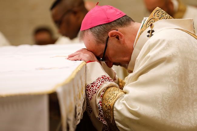 Latin Patriarch of Jerusalem Pierbattista Pizzaballa leads a Christmas midnight Mass at Saint Catherine's Church in the Church of the Nativity in the West Bank town of Bethlehem, Saturday, Dec. 25, 2021. (Mussa Qawasma/Pool Photo via AP)