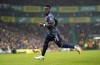 Arsenal's Bukayo Saka celebrates scoring during the English Premier League soccer match between Norwich City and Arsenal at Carrow Stadium, Norwich, England, Sunday Dec. 26, 2021. (Joe Giddens/PA via AP)