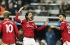 Manchester United's Edinson Cavani, center, celebrates after scoring his side's opening goal during the English Premier League soccer match between Newcastle United and Manchester United at St. James' Park in Newcastle, England, Monday, Dec. 27, 2021. (AP Photo/Jon Super)