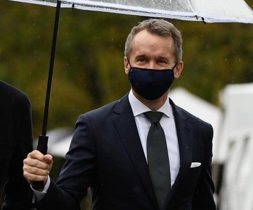 Seamus O'Regan, right, arrives for the cabinet swearing-in ceremony at Rideau Hall in Ottawa, Tuesday, Oct. 26, 2021. Labour Minister O'Regan says he has tested positive for COVID-19 after taking a rapid test.THE CANADIAN PRESS/Justin Tang