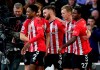 Southampton's James Ward-Prowse, second right, celebrates scoring his side's opening goal during the English Premier League soccer match between Southampton and Tottenham Hotspur, at St. Mary's Stadium, Southampton, England, Tuesday, Dec. 28, 2021. (Andrew Matthews/PA via AP)