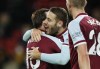 West Ham's Nikola Vlasic, center, celebrates after scoring his side's fourth goal during the English Premier League soccer match between Watford and West Ham United at the Vicarage Road Stadium in Watford, England, Tuesday, Dec. 28, 2021. (AP Photo/David Cliff)