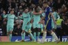 Brighton's Danny Welbeck, center, celebrates with his teammates after scoring his side's opening goal during the English Premier League soccer match between Chelsea and Brighton at Stamford Bridge Stadium in London, England, Wednesday, Dec. 29, 2021. (AP Photo/Alastair Grant)