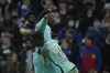 Brighton's Danny Welbeck, top, celebrates after scoring his side's opening goal during the English Premier League soccer match between Chelsea and Brighton at Stamford Bridge Stadium in London, England, Wednesday, Dec. 29, 2021. (AP Photo/Alastair Grant)