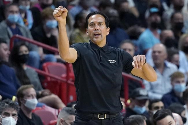 Miami Heat head coach Erik Spoelstra watches during the first half of an NBA basketball game against the Washington Wizards, Tuesday, Dec. 28, 2021, in Miami. (AP Photo/Lynne Sladky)