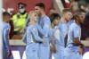 Manchester City's Phil Foden, second left, celebrates after scoring the opening goal during the English Premier League soccer match between Brentford and Manchester City at the Brentford Community Stadium in London, Wednesday, Dec. 29, 2021. (AP Photo/Ian Walton)