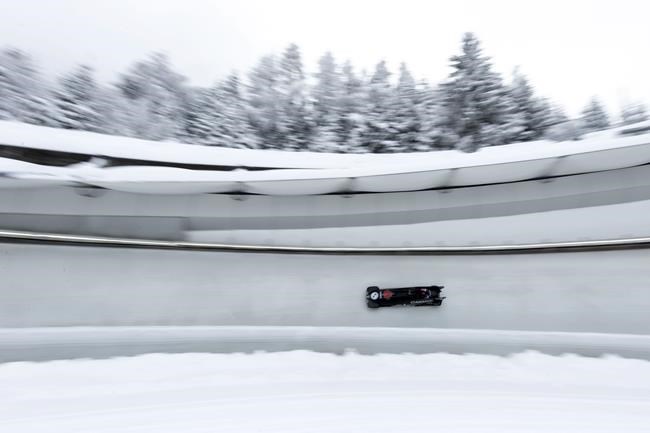 Canadian athletes speed down the track during the women's two-women bobsleigh World Cup race in Igls, near Innsbruck, Austria, Sunday, Nov. 28, 2021. THE CANADIAN PRESS/AP, Lisa Leutner
